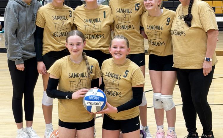 Sandhill Defenders, pictured back l-r: Helper Josie Morrow, Hope McIntosh, Lilly Morrow, Hadley Marsh, Ava Walz, Coach Barb McIntosh. Front: Paisley Ray, Ella Walz. courtesy photo