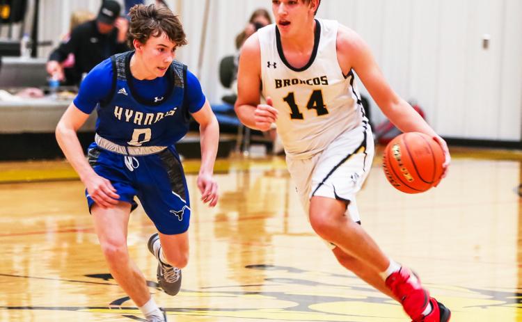 Jacob Walker takes the ball up the court against Hyannis. Megan Andersen